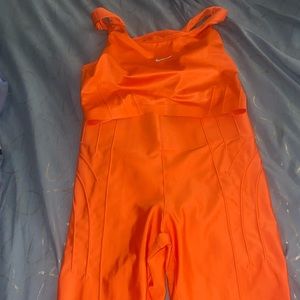 Orange Nike two piece.
